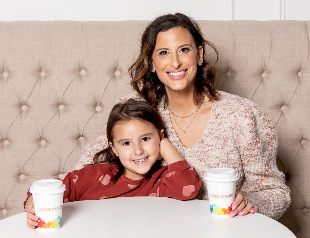 Nina and her daughter in the cafe area of Waterlemon Kids with coffee and hot chocolate