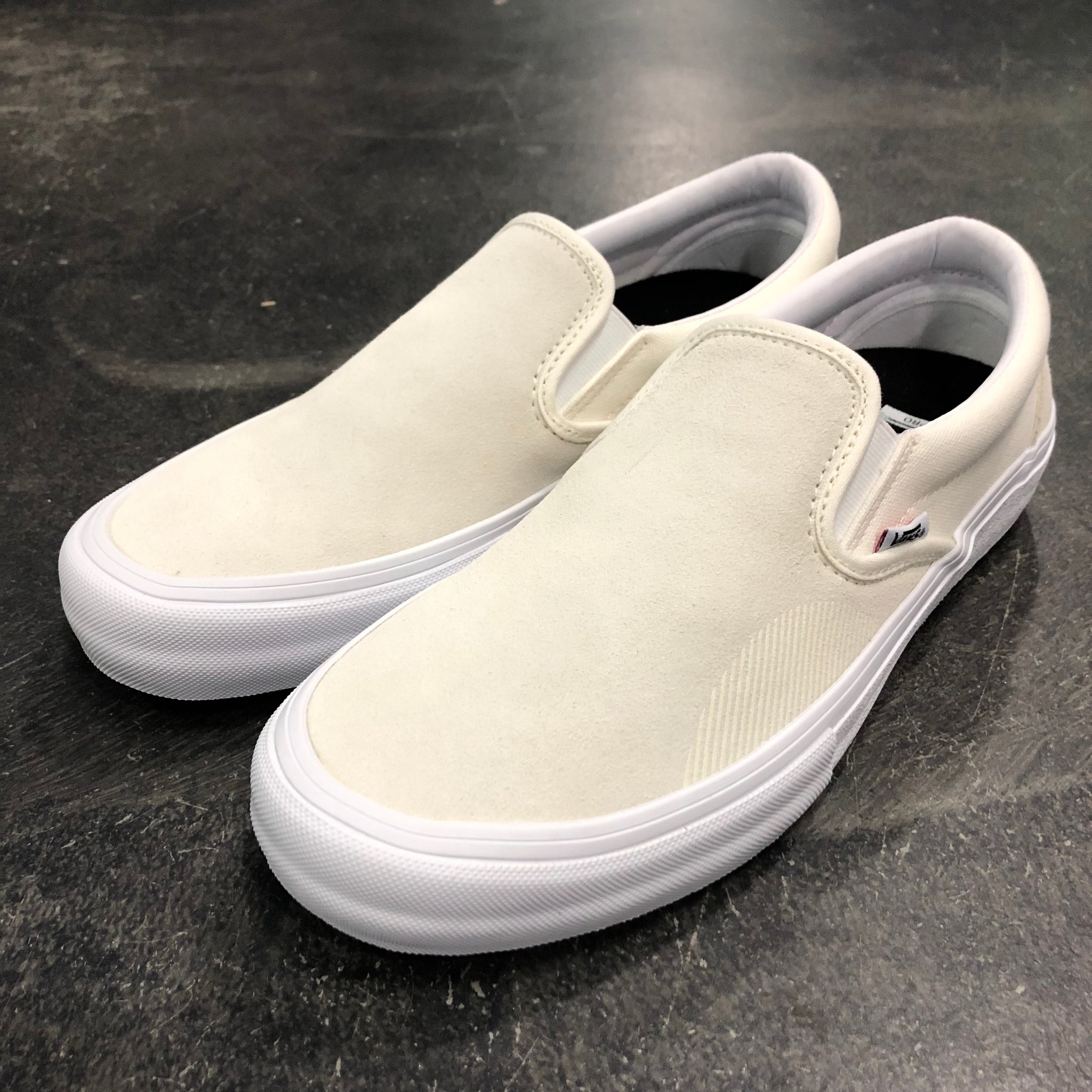 ivory slip on vans