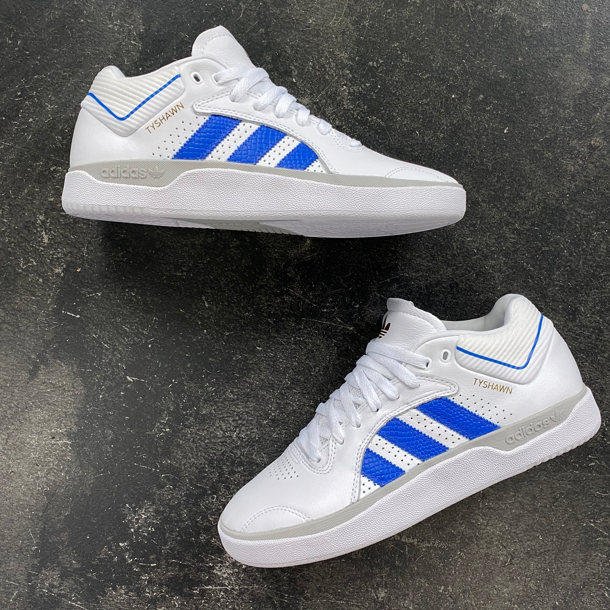 white adidas with blue