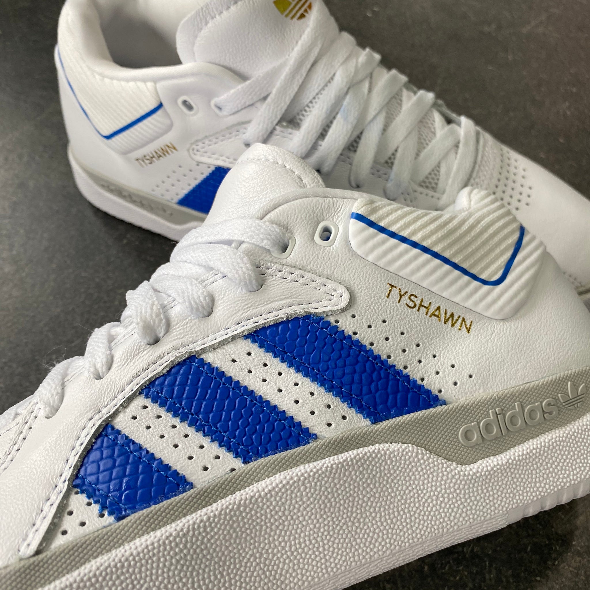 white and blue adidas