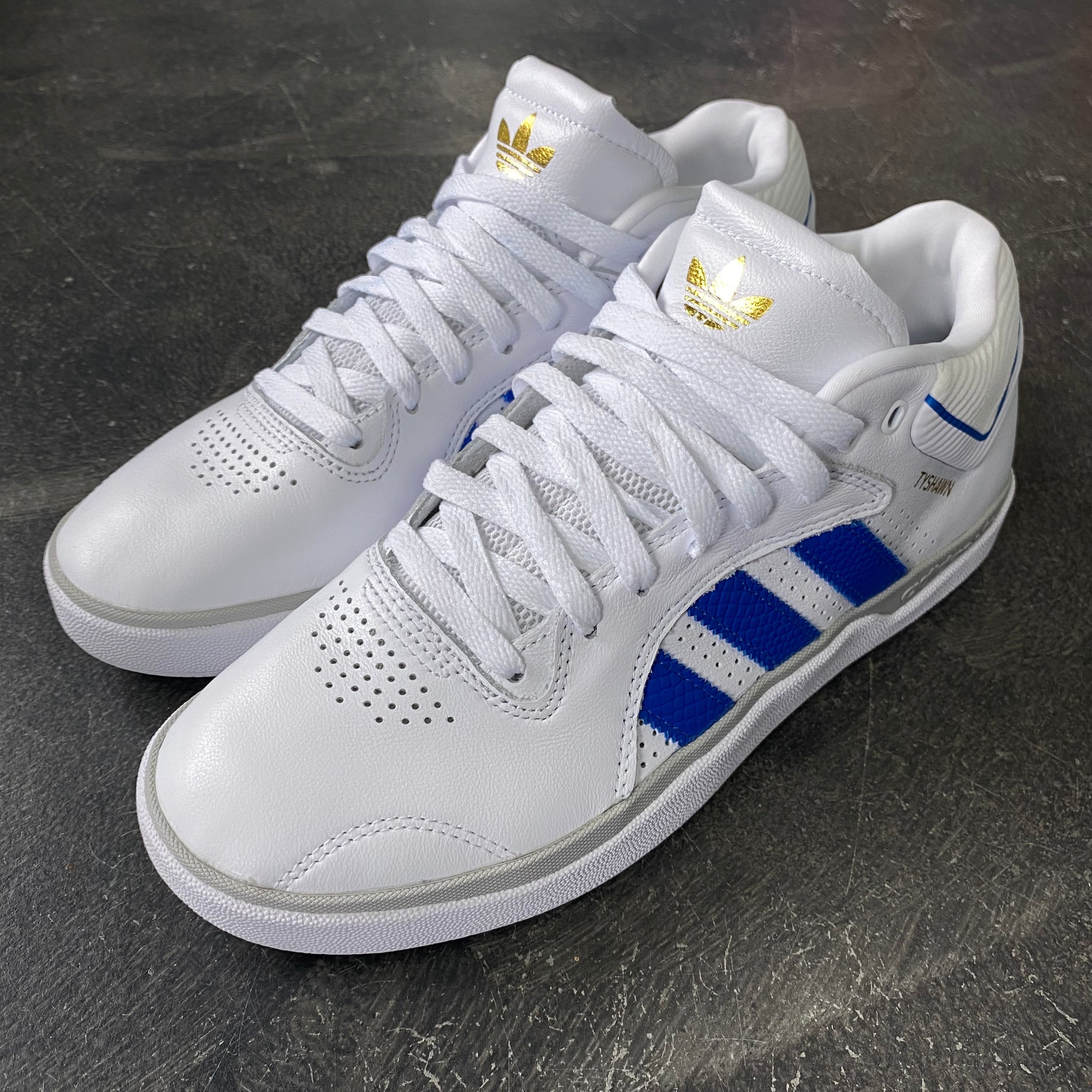 white and blue adidas