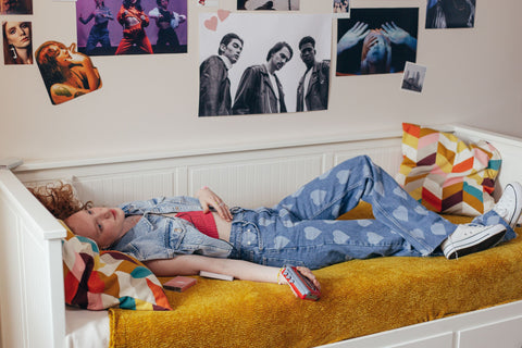 Female student lying on bed.