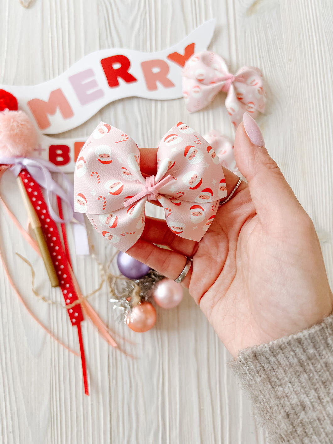 Pink Santas faux leather bow