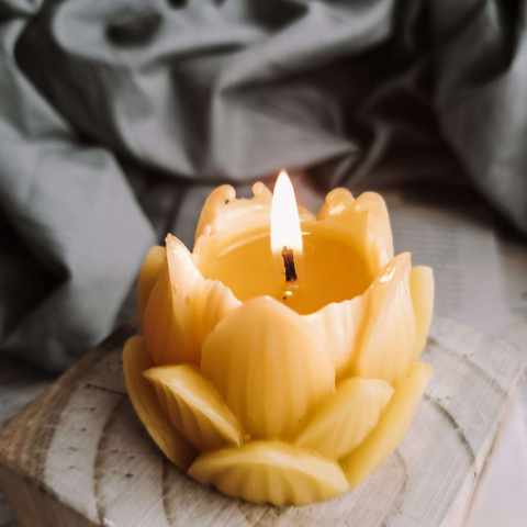 Artisan handcrafted lotus-shaped beeswax candle, perfect for eco-conscious home decor, made in the UK