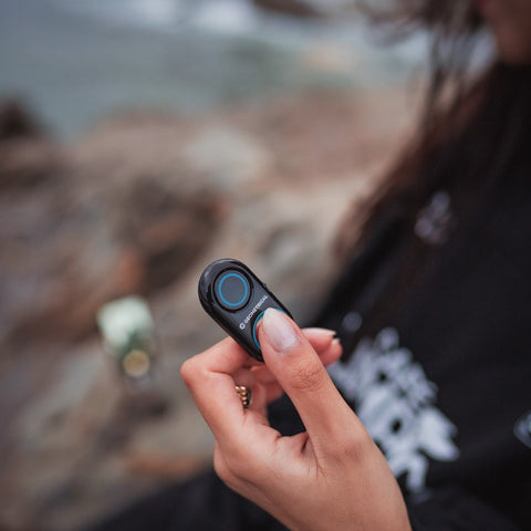 A girl holding a remote in her hand