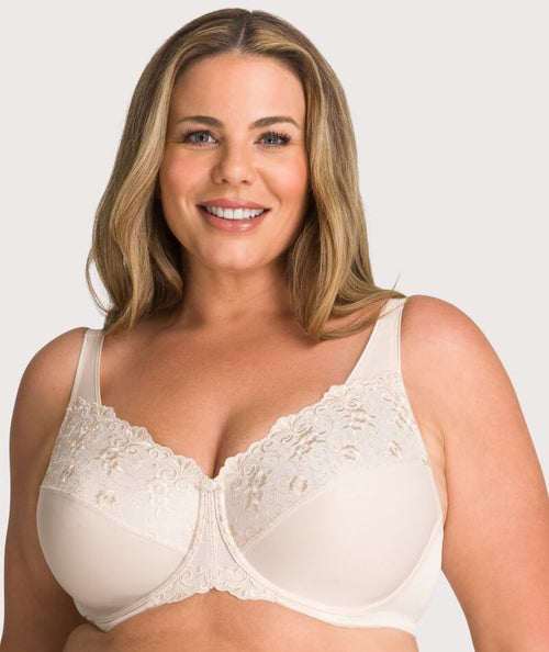 Triumph - Our Flower Minimizer bra has moulded cups that visually reduces  bust size by 1 cup.