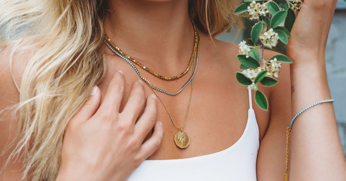 up close of a girl with a necklace stack