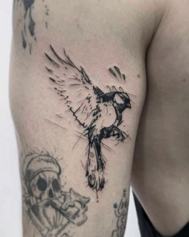 Bird tattoo arm