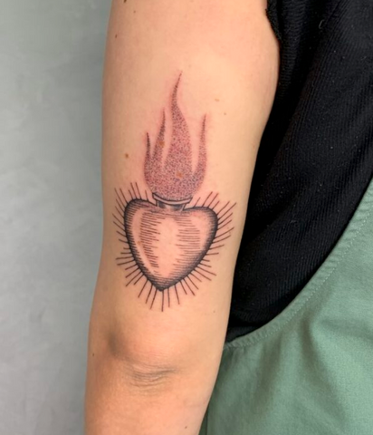 Sacred heart tattoo arm meaning
