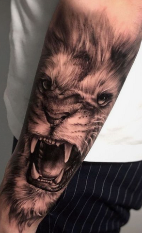 Lion tattoo black and grey realism arm