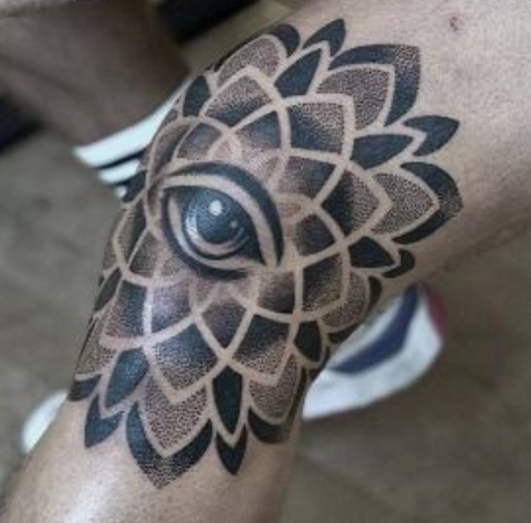 Mandala tattoo knee eye