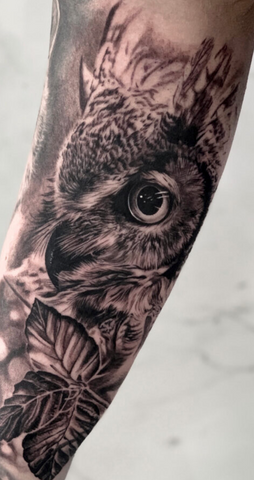 Owl tattoo black and grey realism arm