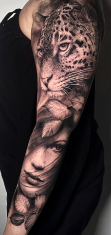 Jaguar tattoo black and grey realism arm sleeve
