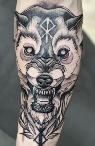 Tattoo wolf geometric on forearm