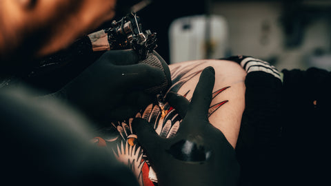tattoo artist over stretch mark