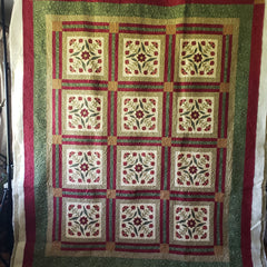 Free motion quilting on floral quilt