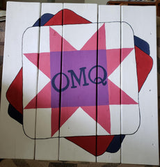 Barn quilt with One More Quilt logo