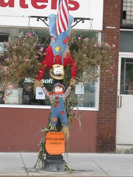 Two Scarecrows on a Lamp Post