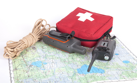 first aid kit and map