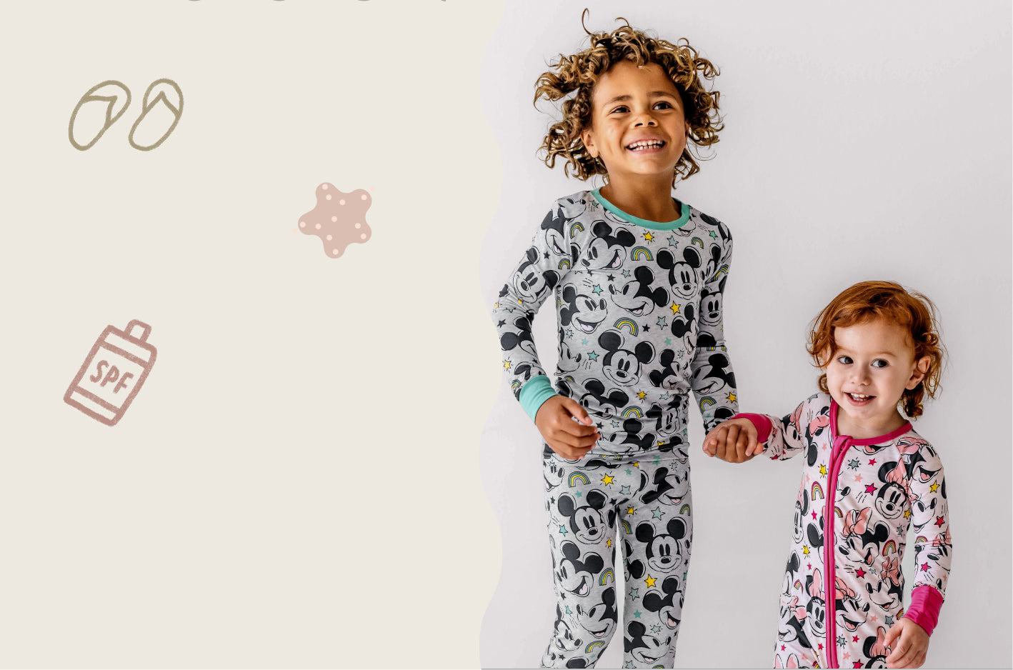 Two children wearing Mickey & Minnie Forever pajamas