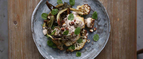 Roast cauliflower steaks, crispy leaves and hazelnut sauce recipe