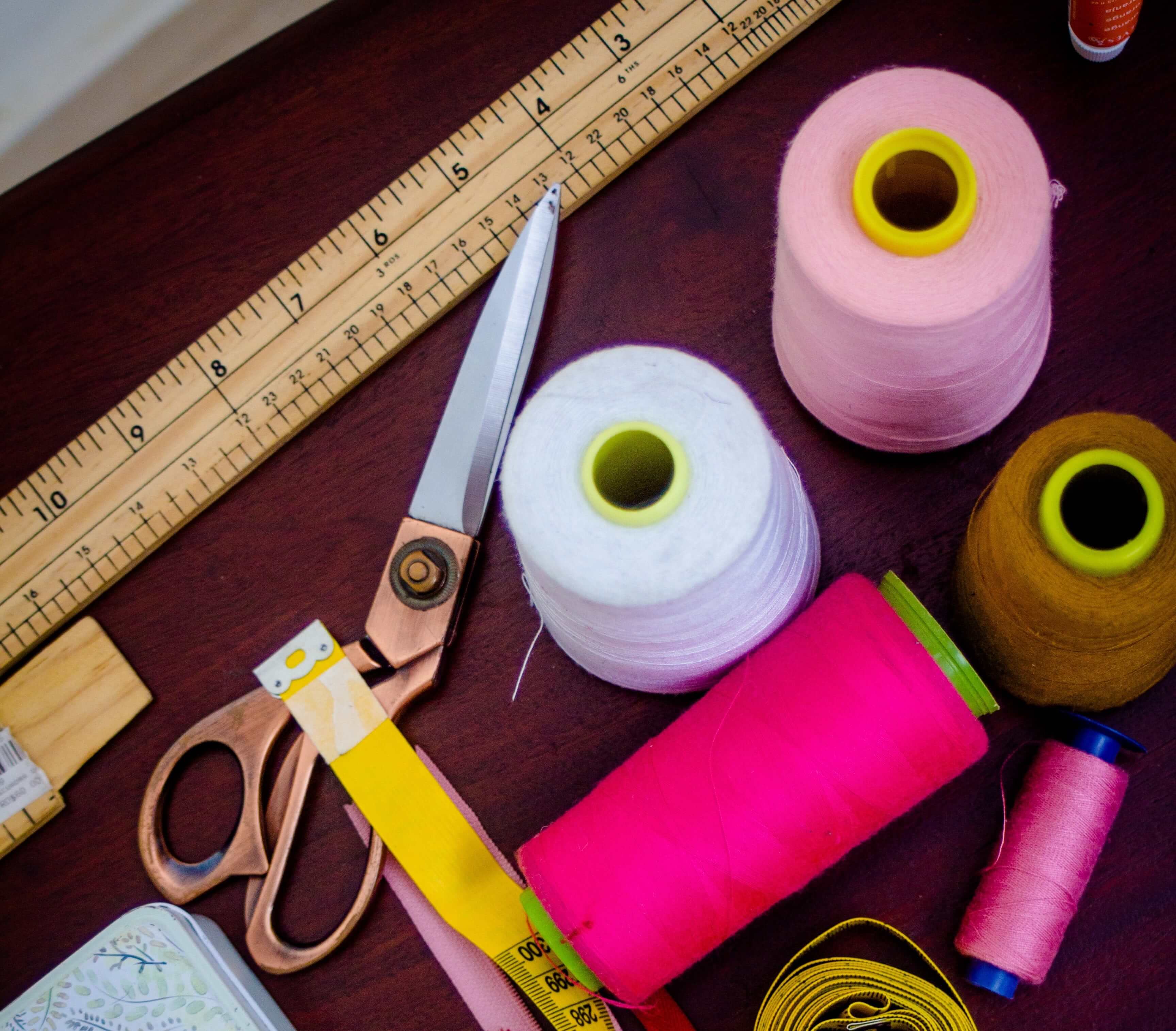 thread, scissors, ruler and sewing apparatuses