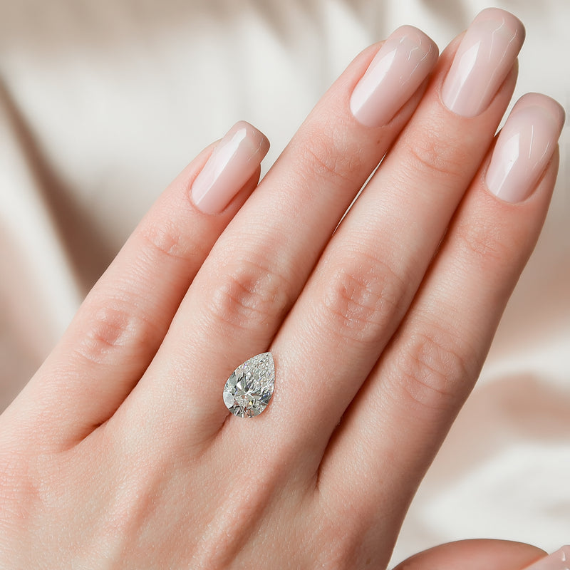 Platinum pear cut halo engagement ring