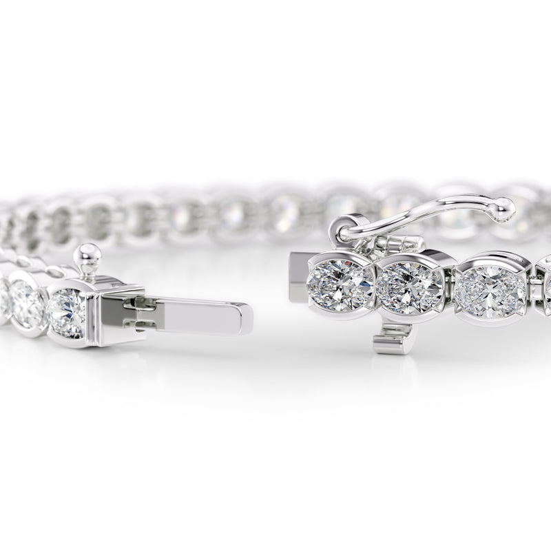 East West Half Bezel Oval Tennis Bracelet 6.0tcw WG