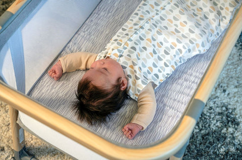 Baby sleeping while in the wearable blanket