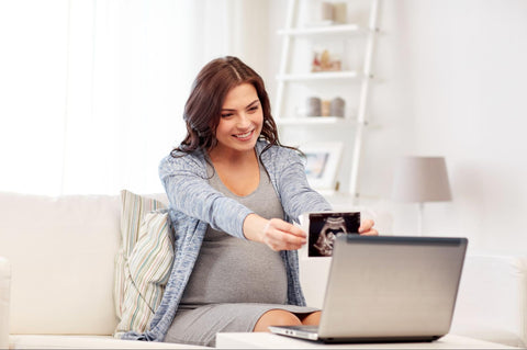 woman showing an xray into a laptop