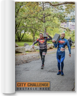 two men carrying bricks in a city challenge obstacle race