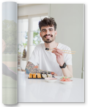 middle aged man eating tofu at a table with chopsticks