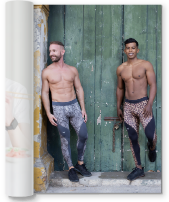 two men wearing animal print leggings and leaning up against a wall