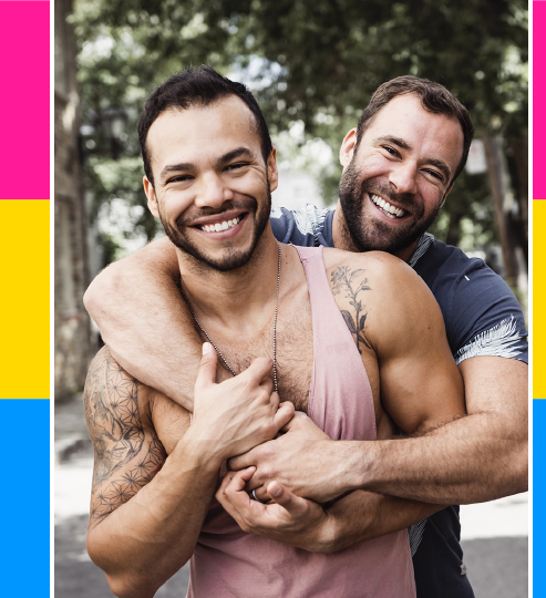 Two muscular men hugging