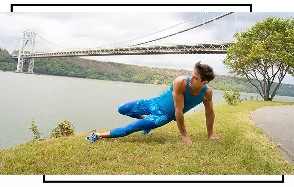 Man stretching in meggings with bridge and river in background