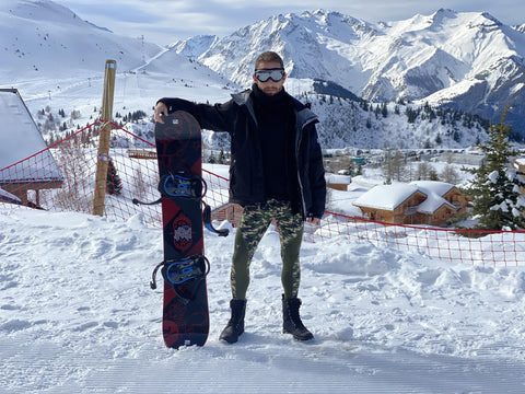 snowboarder standing with board