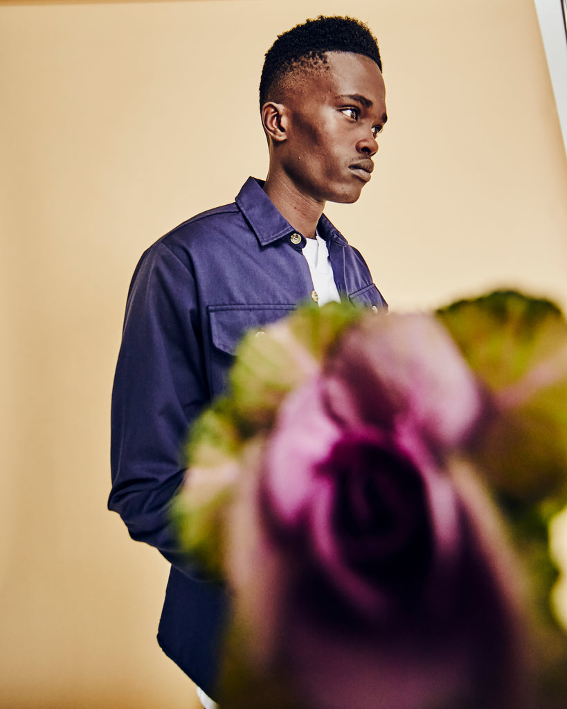 model in navy shirt menswear