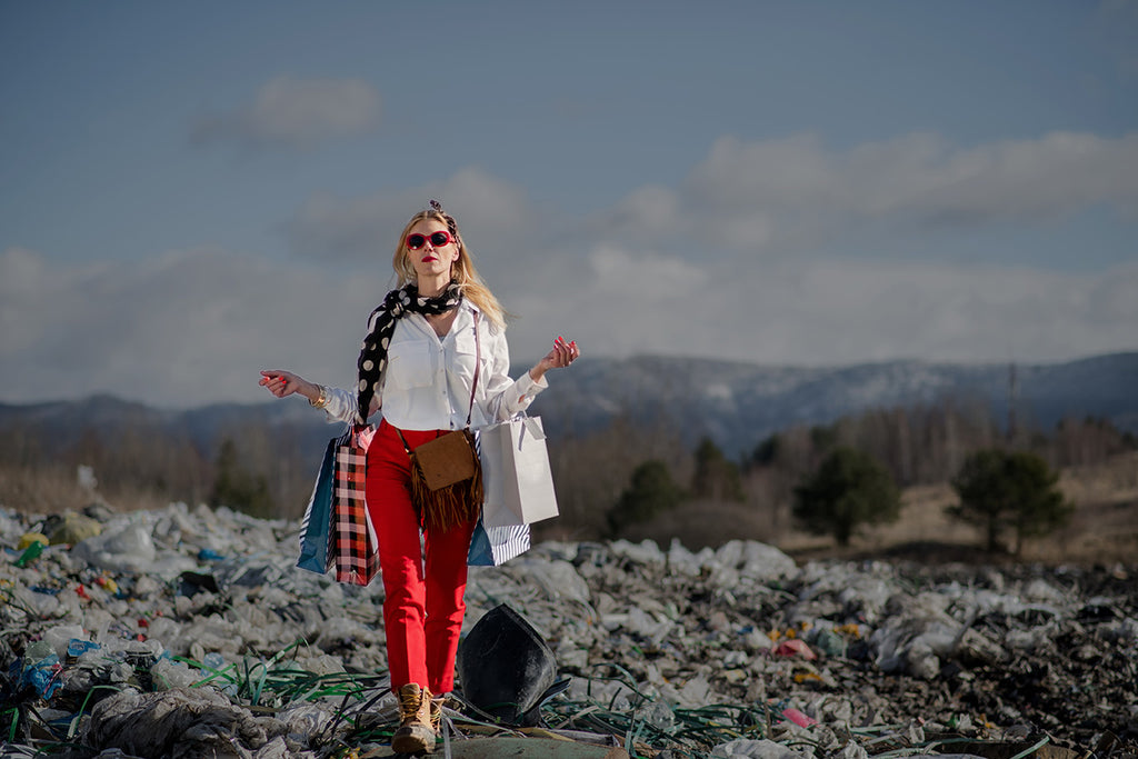 Person walking across landfill with shopping bags