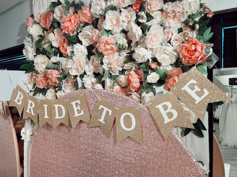 Bride to be flower wall inside The Bridal Boutique