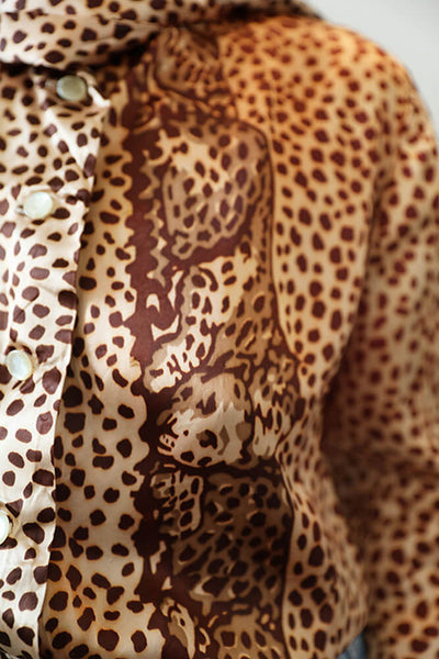 Leopard engineered print on the Vintage 70s leopard print jabow sateen blouse for Cura Found.
