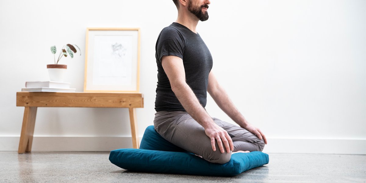 sitting on meditation cushion