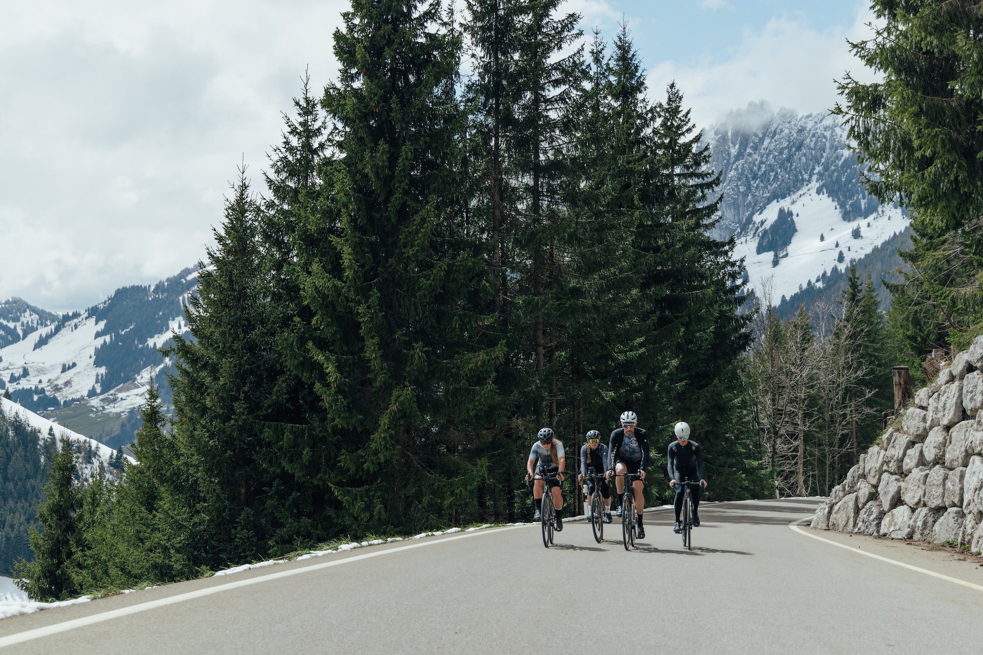 Three cyclists riding in Switzerland