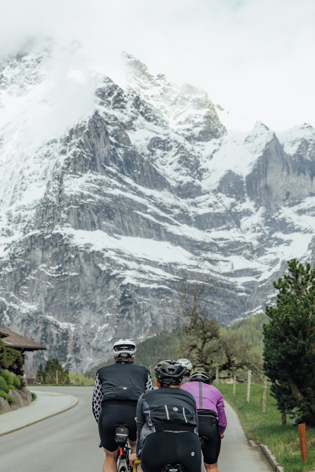 Cyclists riding in Switzerland heading to the mountains