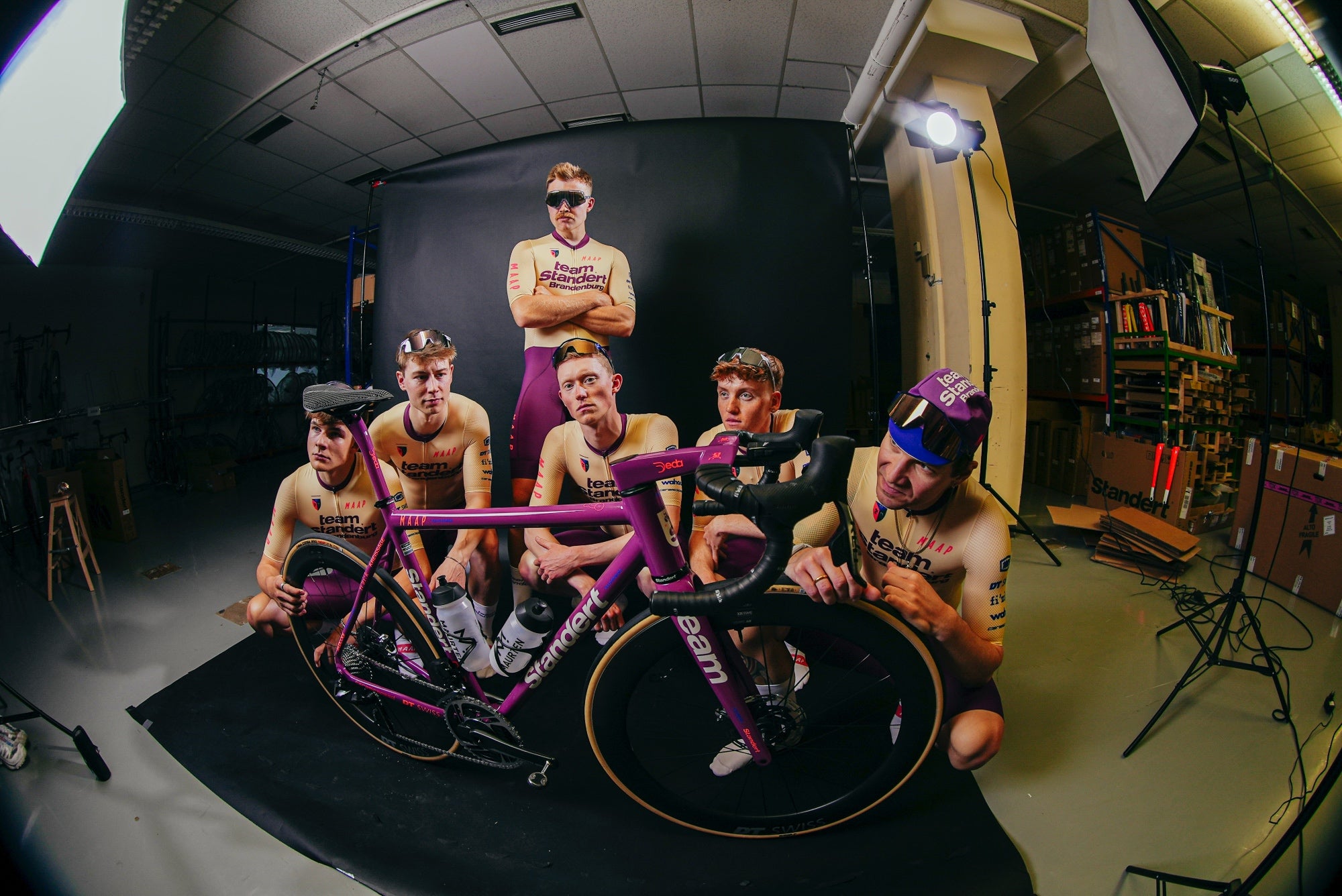 Team Standert Brandenburg in a studio with the team bike