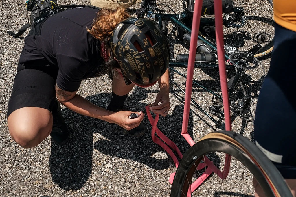 A cyclist fixing a puncture