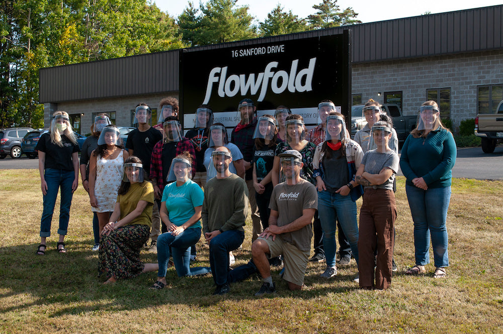 flowfold team in front of ppe manufacturing facility wearing face shields