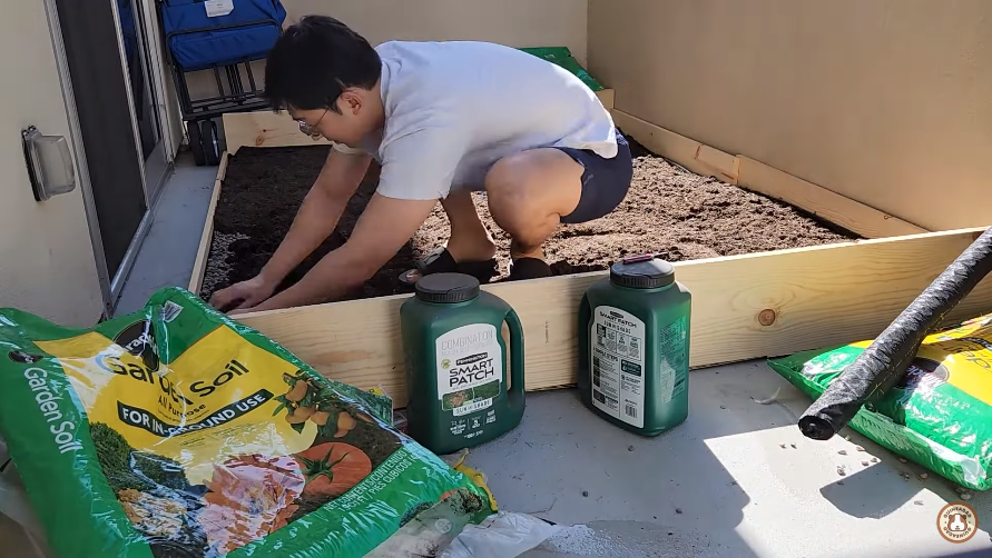 guineadad spreading garden soil