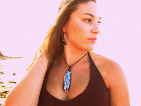 woman wearing kyanite crystal healing necklace