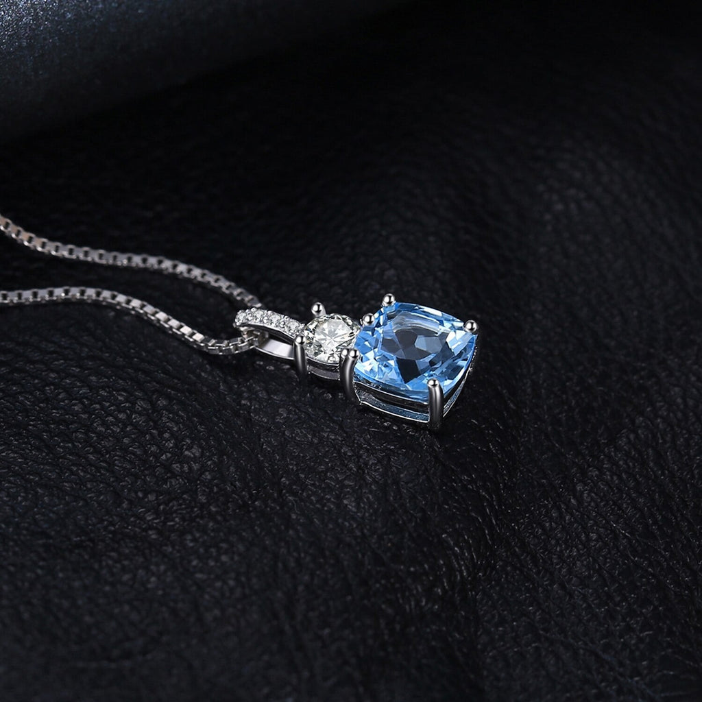 november birthstone necklace with blue topaz gem