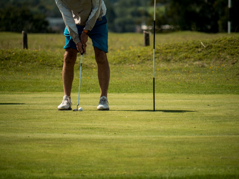 A golfer holding their grip before shot